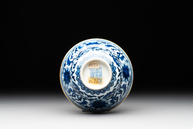 A Chinese gilt-decorated blue and white 'lotus scroll' bowl, Daoguang mark and of the period