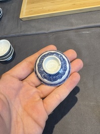 A collection of 32 pieces Chinese blue and white cups, saucers and covers with floral design, Qianlong