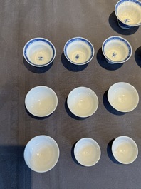 A collection of 32 pieces Chinese blue and white cups, saucers and covers with floral design, Qianlong