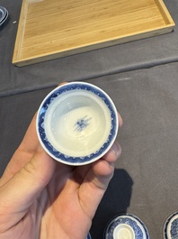 A collection of 32 pieces Chinese blue and white cups, saucers and covers with floral design, Qianlong