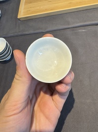 A collection of 32 pieces Chinese blue and white cups, saucers and covers with floral design, Qianlong