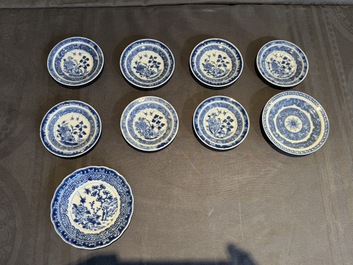 A collection of 32 pieces Chinese blue and white cups, saucers and covers with floral design, Qianlong