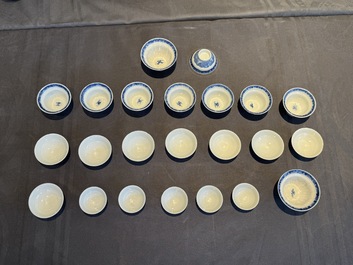 A collection of 32 pieces Chinese blue and white cups, saucers and covers with floral design, Qianlong