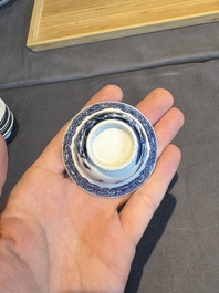 A collection of 32 pieces Chinese blue and white cups, saucers and covers with floral design, Qianlong