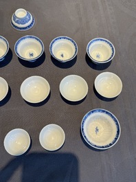 A collection of 32 pieces Chinese blue and white cups, saucers and covers with floral design, Qianlong