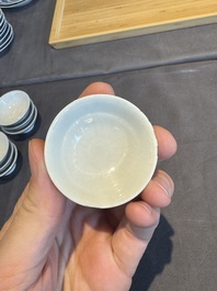 A collection of 32 pieces Chinese blue and white cups, saucers and covers with floral design, Qianlong