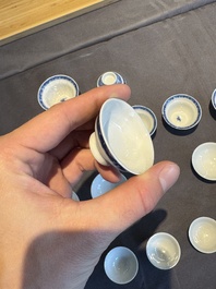 A collection of 32 pieces Chinese blue and white cups, saucers and covers with floral design, Qianlong