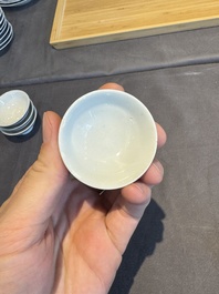 A collection of 32 pieces Chinese blue and white cups, saucers and covers with floral design, Qianlong