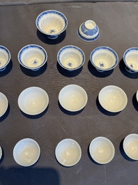 A collection of 32 pieces Chinese blue and white cups, saucers and covers with floral design, Qianlong