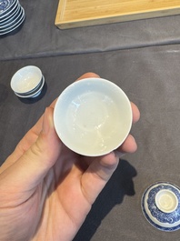 A collection of 32 pieces Chinese blue and white cups, saucers and covers with floral design, Qianlong