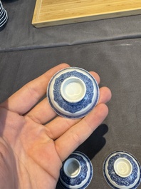 A collection of 32 pieces Chinese blue and white cups, saucers and covers with floral design, Qianlong