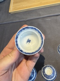 A collection of 32 pieces Chinese blue and white cups, saucers and covers with floral design, Qianlong