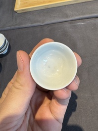 A collection of 32 pieces Chinese blue and white cups, saucers and covers with floral design, Qianlong