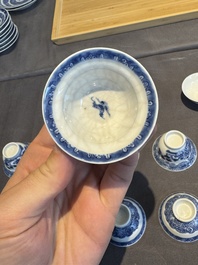 A collection of 32 pieces Chinese blue and white cups, saucers and covers with floral design, Qianlong