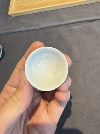 A collection of 32 pieces Chinese blue and white cups, saucers and covers with floral design, Qianlong