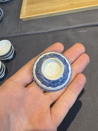 A collection of 32 pieces Chinese blue and white cups, saucers and covers with floral design, Qianlong
