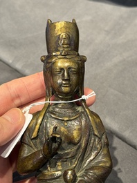 A Chinese bronze seated Guanyin on a lotus throne, probably Liao