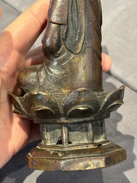 A Chinese bronze seated Guanyin on a lotus throne, probably Liao