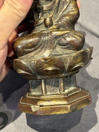 A Chinese bronze seated Guanyin on a lotus throne, probably Liao