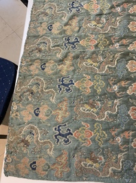 A Chinese green-ground embroidered silk panel with dragons among clouds, 18th C.