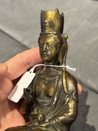 A Chinese bronze seated Guanyin on a lotus throne, probably Liao