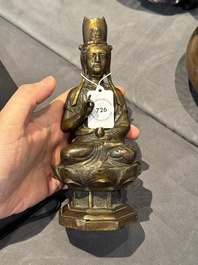 A Chinese bronze seated Guanyin on a lotus throne, probably Liao