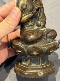 A Chinese bronze seated Guanyin on a lotus throne, probably Liao