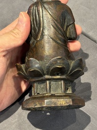 A Chinese bronze seated Guanyin on a lotus throne, probably Liao
