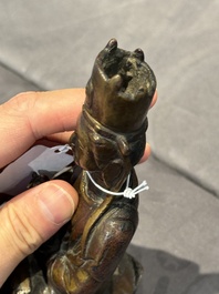 A Chinese bronze seated Guanyin on a lotus throne, probably Liao