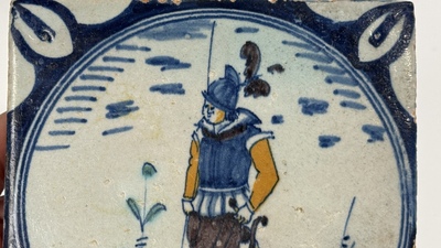 A polychrome Dutch Delft maiolica 'medallion' 'soldier' tile, late 16th C.