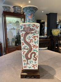 A pair of Chinese famille verte 'dragon' vases and wooden stands, Chenghua mark, 19th C.