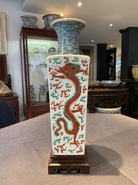A pair of Chinese famille verte 'dragon' vases and wooden stands, Chenghua mark, 19th C.