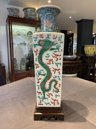 A pair of Chinese famille verte 'dragon' vases and wooden stands, Chenghua mark, 19th C.