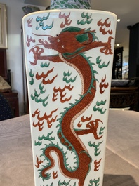 A pair of Chinese famille verte 'dragon' vases and wooden stands, Chenghua mark, 19th C.