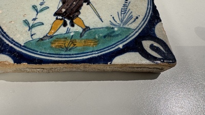 A polychrome Dutch Delft maiolica 'medallion' 'soldier' tile, late 16th C.
