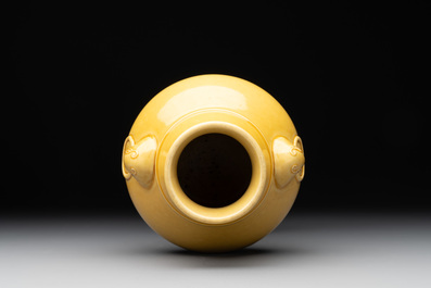 A Chinese yellow-glazed 'hu' vase, Qianlong mark, 19/20th C.