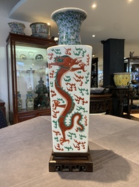 A pair of Chinese famille verte 'dragon' vases and wooden stands, Chenghua mark, 19th C.