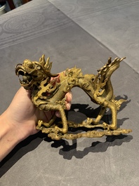 A pair of Chinese gilt bronze dragons among flames and clouds, 19/20th C.