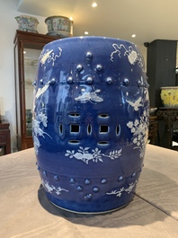 A pair of Chinese white slip-decorated blue-ground garden seats, 19th C.