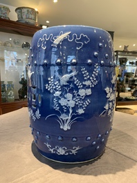 A pair of Chinese white slip-decorated blue-ground garden seats, 19th C.