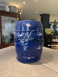 A pair of Chinese white slip-decorated blue-ground garden seats, 19th C.