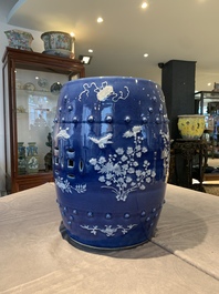 A pair of Chinese white slip-decorated blue-ground garden seats, 19th C.