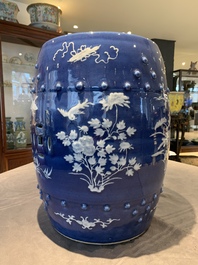 A pair of Chinese white slip-decorated blue-ground garden seats, 19th C.