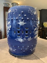 A pair of Chinese white slip-decorated blue-ground garden seats, 19th C.