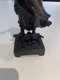 A fine Chinese bronze Luohan holding a sutra, Ming