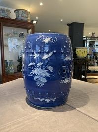 A pair of Chinese white slip-decorated blue-ground garden seats, 19th C.