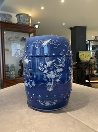 A pair of Chinese white slip-decorated blue-ground garden seats, 19th C.
