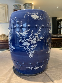 A pair of Chinese white slip-decorated blue-ground garden seats, 19th C.