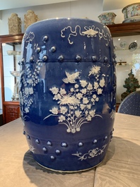A pair of Chinese white slip-decorated blue-ground garden seats, 19th C.