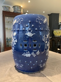 A pair of Chinese white slip-decorated blue-ground garden seats, 19th C.